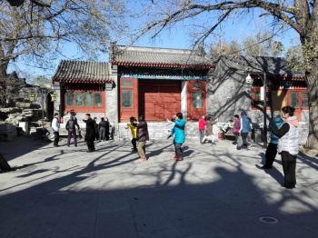 A Tai Chi master practices hismoves in front of his class.